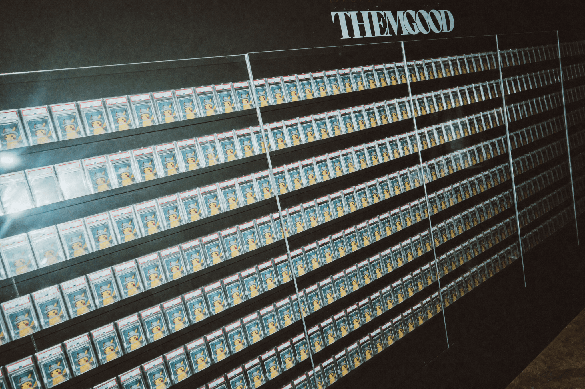 THEMGOOD, the inaugural project of MemeStrategy and internationally renowned gallery Gana Art’s planned joint venture, featured a large-scale wall installation comprising 500 PSA 10 “Pikachu with Grey Felt Hat” promotional cards.